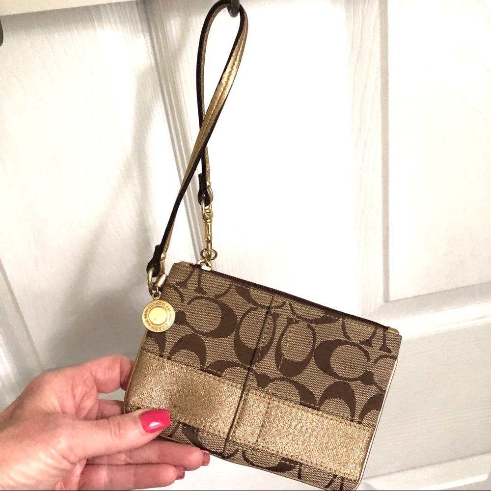Coach signature tan wristlet, gold strap & stripe